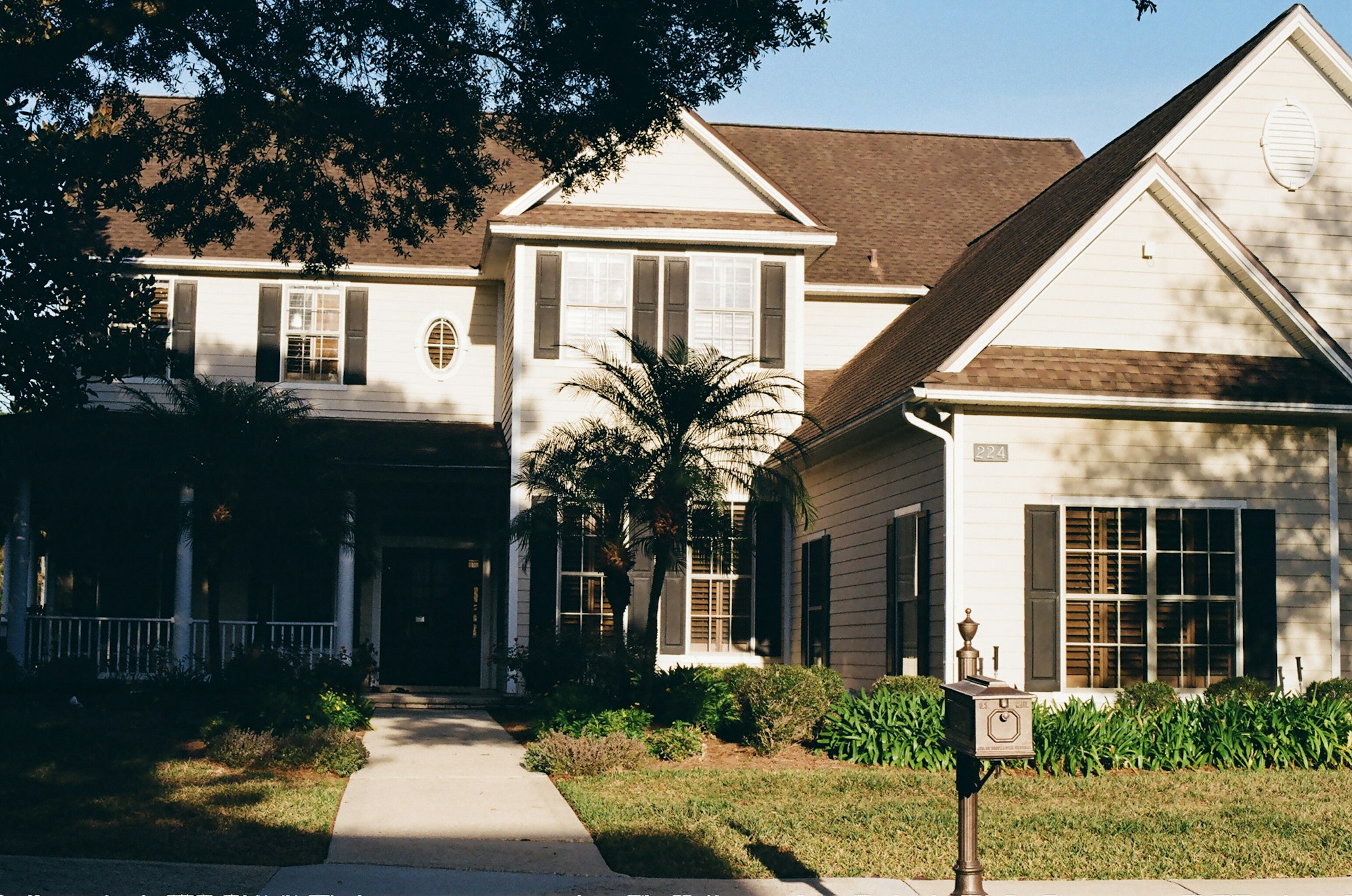 A two-story home with a covered front porch
