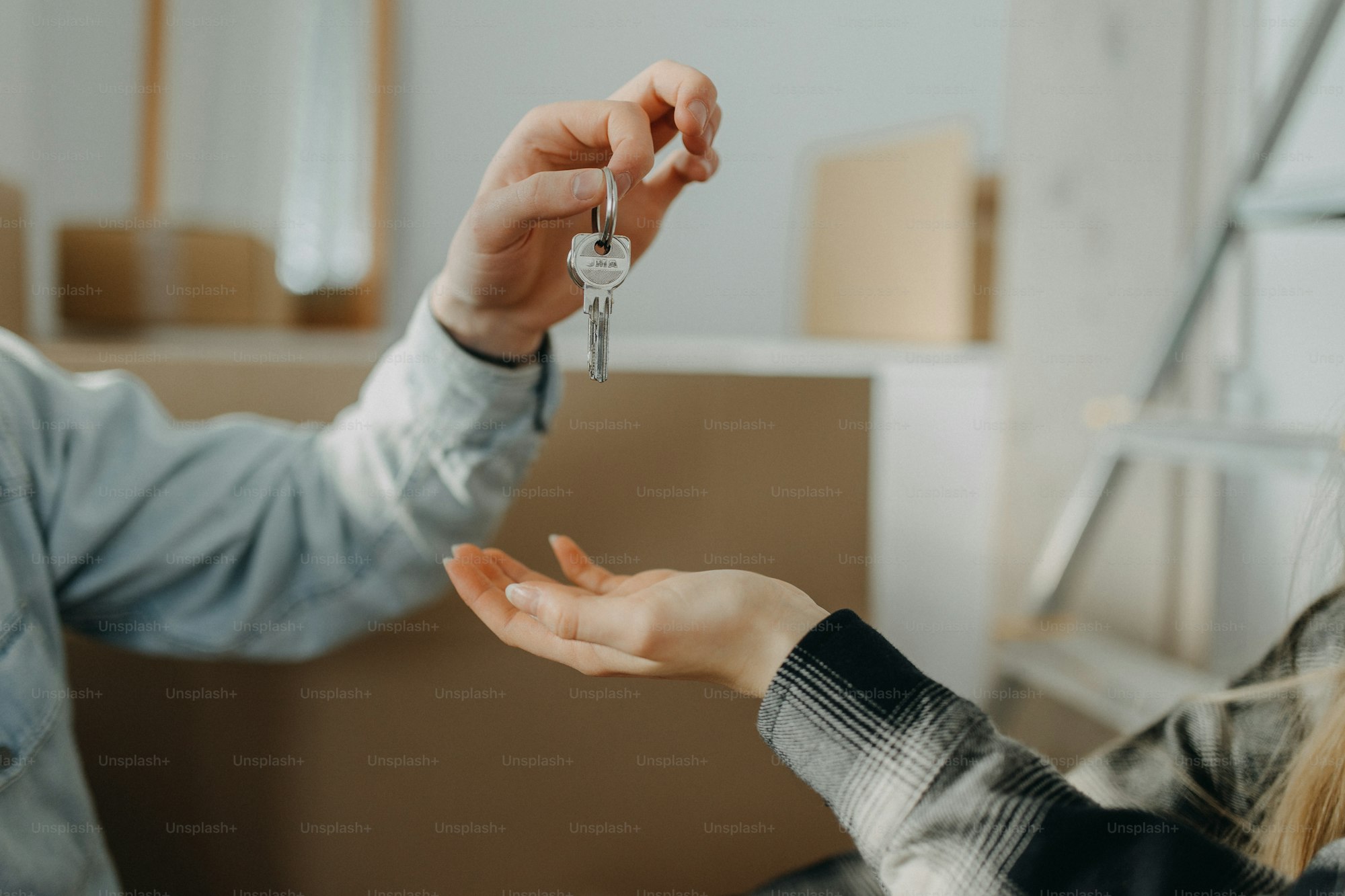 Keys being handed over at a closing